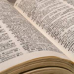 A close-up photograh of a dictionary lying open.